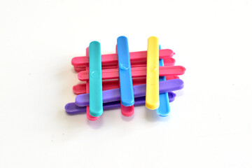 Colored counting sticks for schoolchildren lie on a white background.