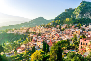 Fototapeta premium Taormina town, Sicily, Italy. View of Taormina town sunset landscape with mouintain evening beautiful sunset golden light