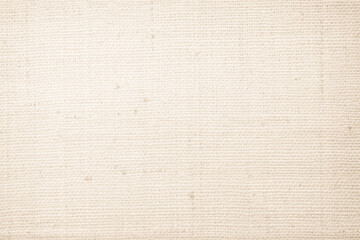 Jute hessian sackcloth canvas woven texture pattern background in light beige cream brown color blank empty.