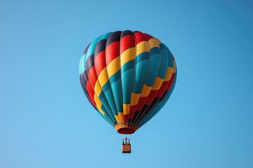 Obraz premium A colorful hot air balloon floating high in a blue sky