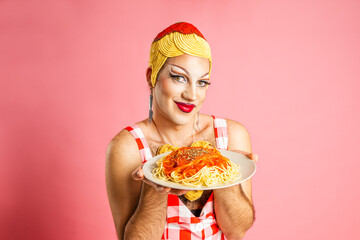 Cheerful Drag Queen Presents Spaghetti in a Fun Italian-themed Studio Portrait