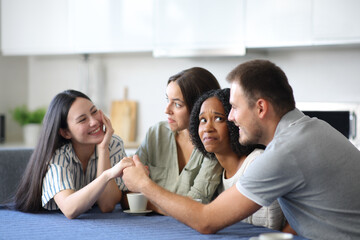 Couple flirting ignoring their uncomfortable friends