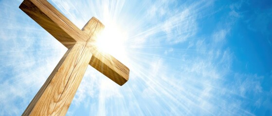 Wooden cross against the bright blue sky, powerful sunlight beams, spiritual symbolism, Easter celebration, faith, hope, religious imagery, uplifting message.
