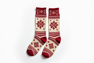 Cozy winter socks with traditional Nordic pattern on white background.