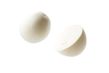 Two white round fruits with one of them cut in half, isolated