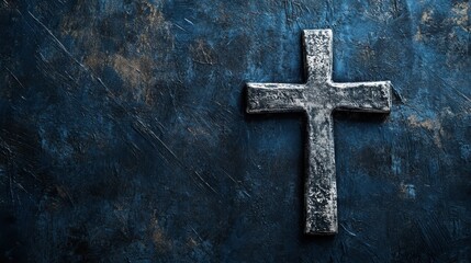Rustic metal cross on textured blue background, symbolizing faith, spirituality, Christian beliefs, Easter, prayer, reflection, and hope in challenging times.