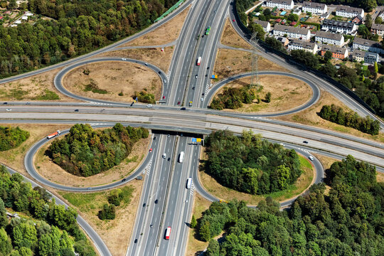 Aerial view of a highway junction with overpass and surrounding landscape
