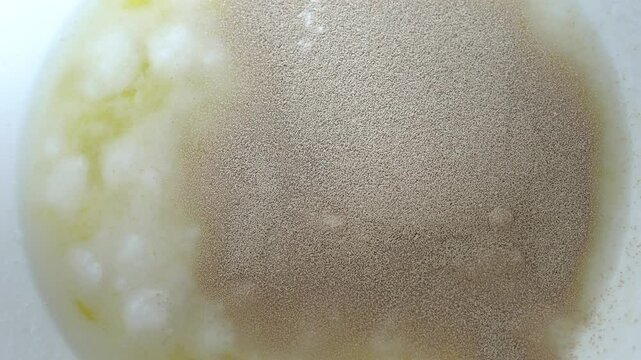 Adding vanillin and yeast to make the dough. Preparation of yeast dough.
