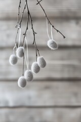 Easter decoration with hanging white eggs on branches, minimalist spring aesthetic, seasonal home decor, celebrating Easter traditions, nature-inspired design.