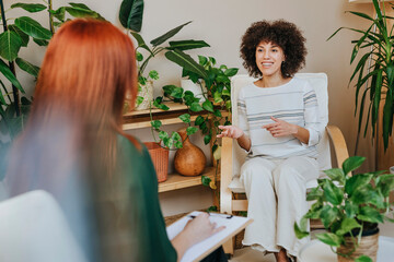 Consultation meeting between a coach and a client in an office setting