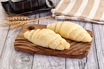 Raw uncooked croissant for bake