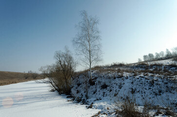A small river under the ice on a clear day