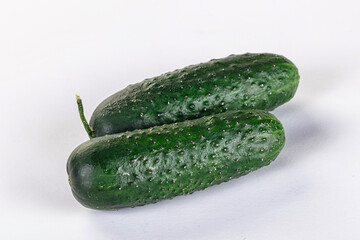 Ripe green raw two cucumbers