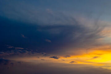 Obraz premium Hazy sky at sunset. Cloudscape at sunset with orange clouds