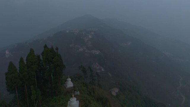 Aerial, drone shot 4k. Aerial view of the foggy day in Pelling, Sikkim. Northern India. Indian Mountain. D Log. Bird eye View. Travelling Northeast Video. Indian mountain village. IN front of Skywalk.