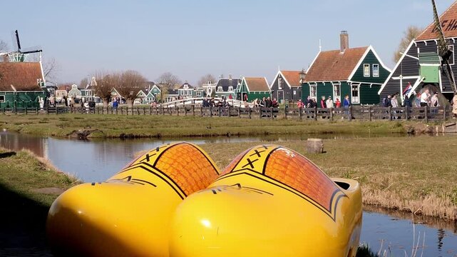Tourists visiting the historic mills at the Zaanse Schans in Zaandijk, North Holland, Netherlands