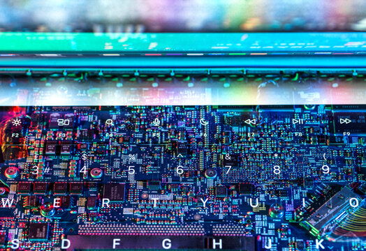 Close-up of a colorful circuit board and keyboard representing technology and artificial intelligence