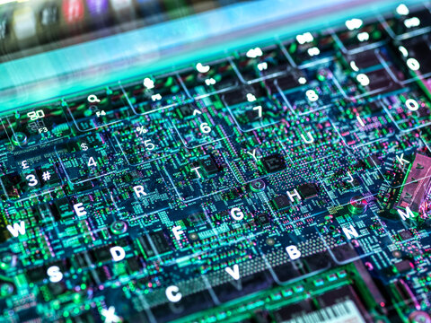 Abstract view of a circuit board overlay on a keyboard representing technology and artificial intelligence