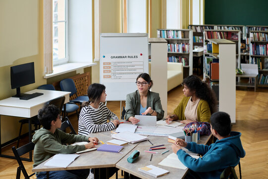 High angle view of a diverse group having a language class in a library