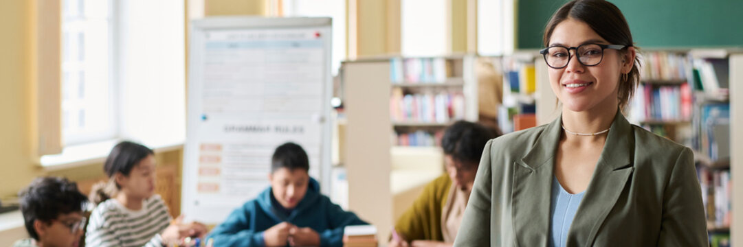 Teacher leading a lesson in a classroom with students engaged in learning