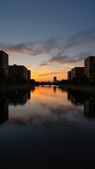 Fototapeta premium Canal Sunset in Canada Ottawa shows vibrant sunset over calm water with reflections. Concept of peace and serenity captured in Canal Sunset in Canada Ottawa landscape.