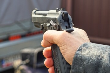 one black iron automatic dangerous with handle and barrel and trigger loaded modern combat military...