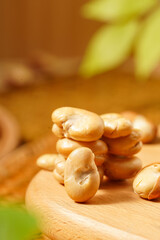Baked broad beans on a plate, delicious snack