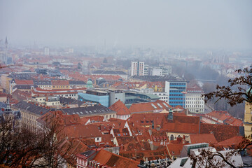 Graz cityscape on foggy day. Panoramic view of Graz, Austria with historical architecture. Streets...
