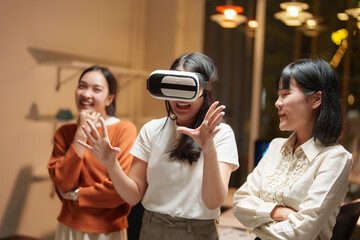 Excited designers testing virtual reality headset in office