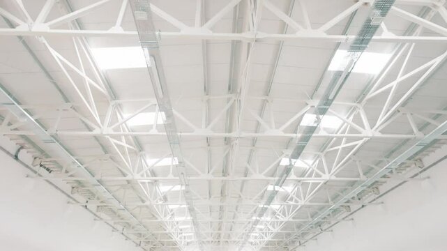 White industrial ceiling structure with epoxy floor resin