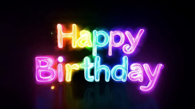 Colorful neon happy birthday text glowing in rainbow colors on dark background with festive light effect