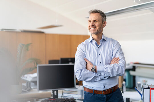 Portrait of smiling businessman in office
