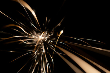 sparks from the grinder glowing in the dark