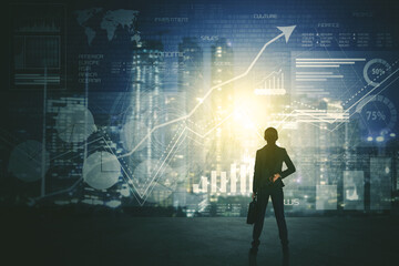 Back view of businessman using a futuristic HUD interface screen