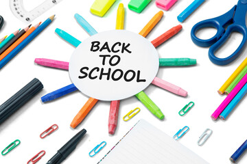 Round paper near multicolored stationery