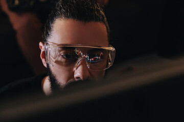 Financial analyst examining market trends with candlestick chart reflection in glasses