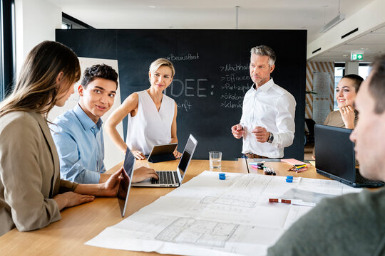 Business people having a workshop in office, discussing plans
