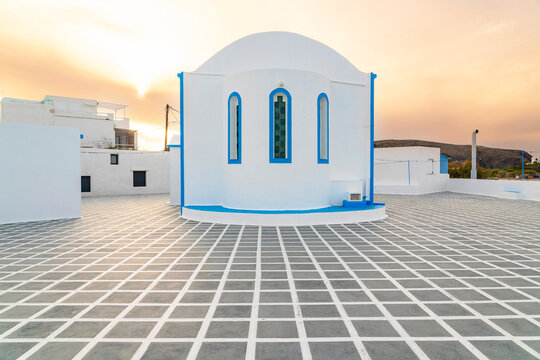 Catholic church in Pollonia, Milos at sunset with geometric tiles