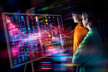 Two people collaborating on a digital screen with augmented reality and data visualization