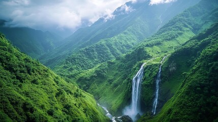 Beautiful waterfall in green rain forest, top view. Tropical in mountain jungle. Waterfall in the tropical forest