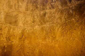 Surface showcases a golden texture with variations, reflecting soft light and inviting detail...