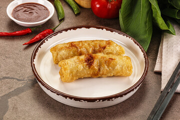 Vietnamese stuffed spring roll served sauce