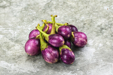 Small organic young purple round eggplant