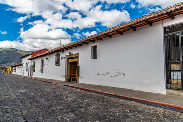 A view down a long straight cobbled street in Antigua in Guatemala in early springtime