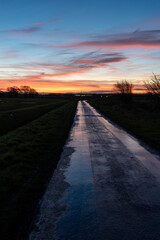 Colourful sunrise over rural road