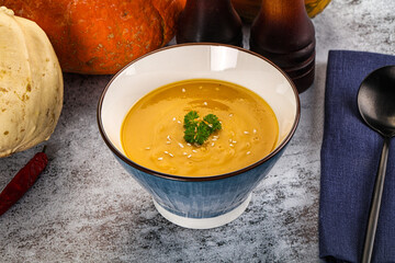 Vegan pumpkin cream soup served sesam