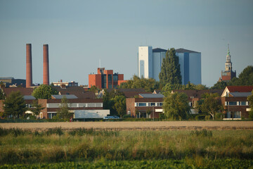 Obraz premium View of a suburban landscape with industrial buildings and modern architecture during golden hour