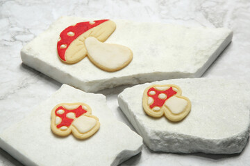 Thin homemade biscuits. Woodland red mushroom with white dots. Sugar cookies for party, Easter or baby shower.	