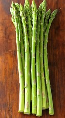 Fresh Green Asparagus Spears on Wooden Board