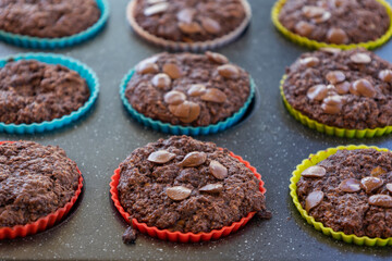  chocolate banana muffins on light background